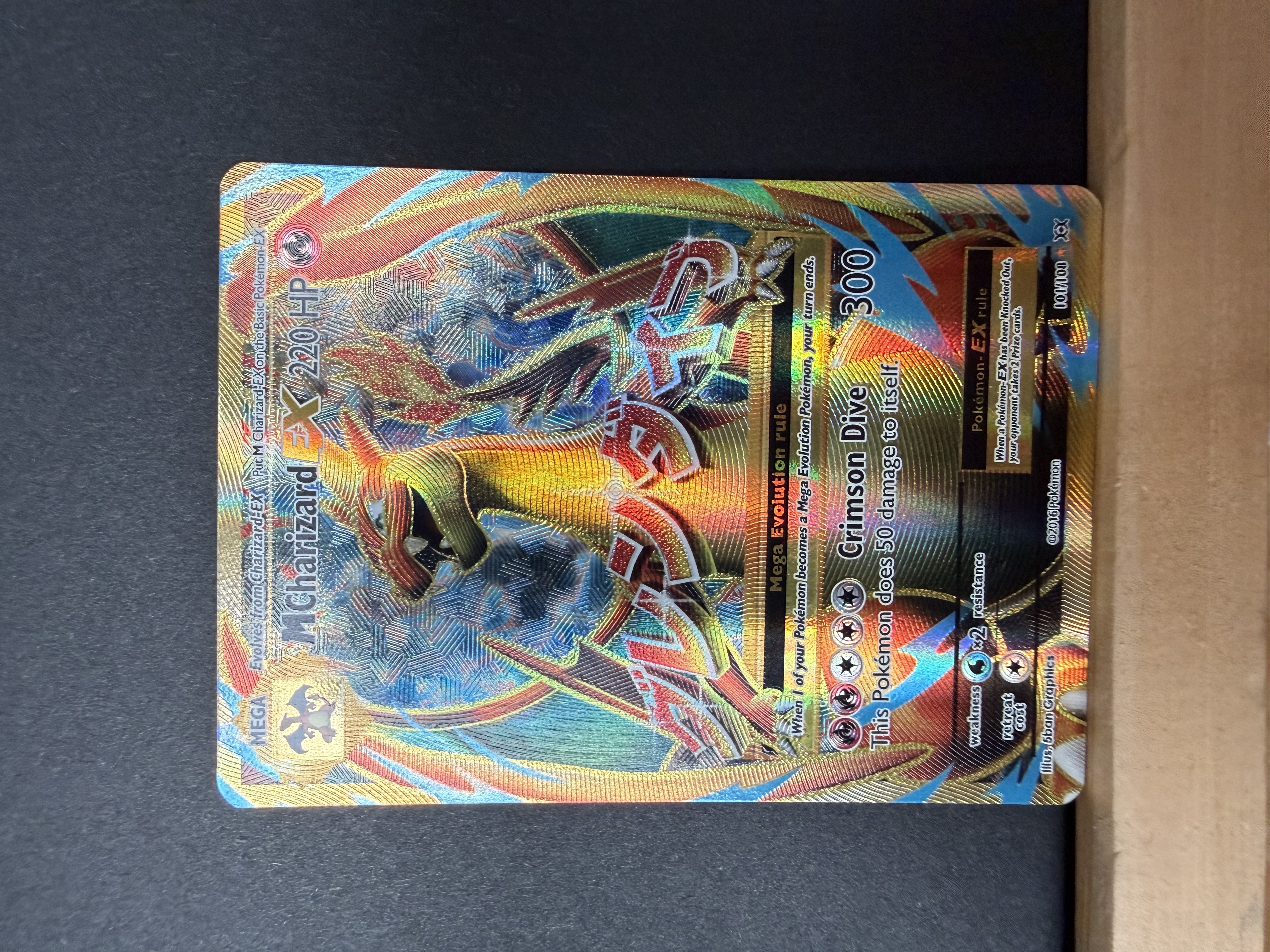 M Charizard EX full-art card from Joe’s collection